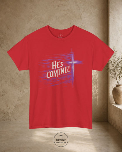 Red t-shirt with 'HE'S COMING!' text and cross graphic on a beige wall background
