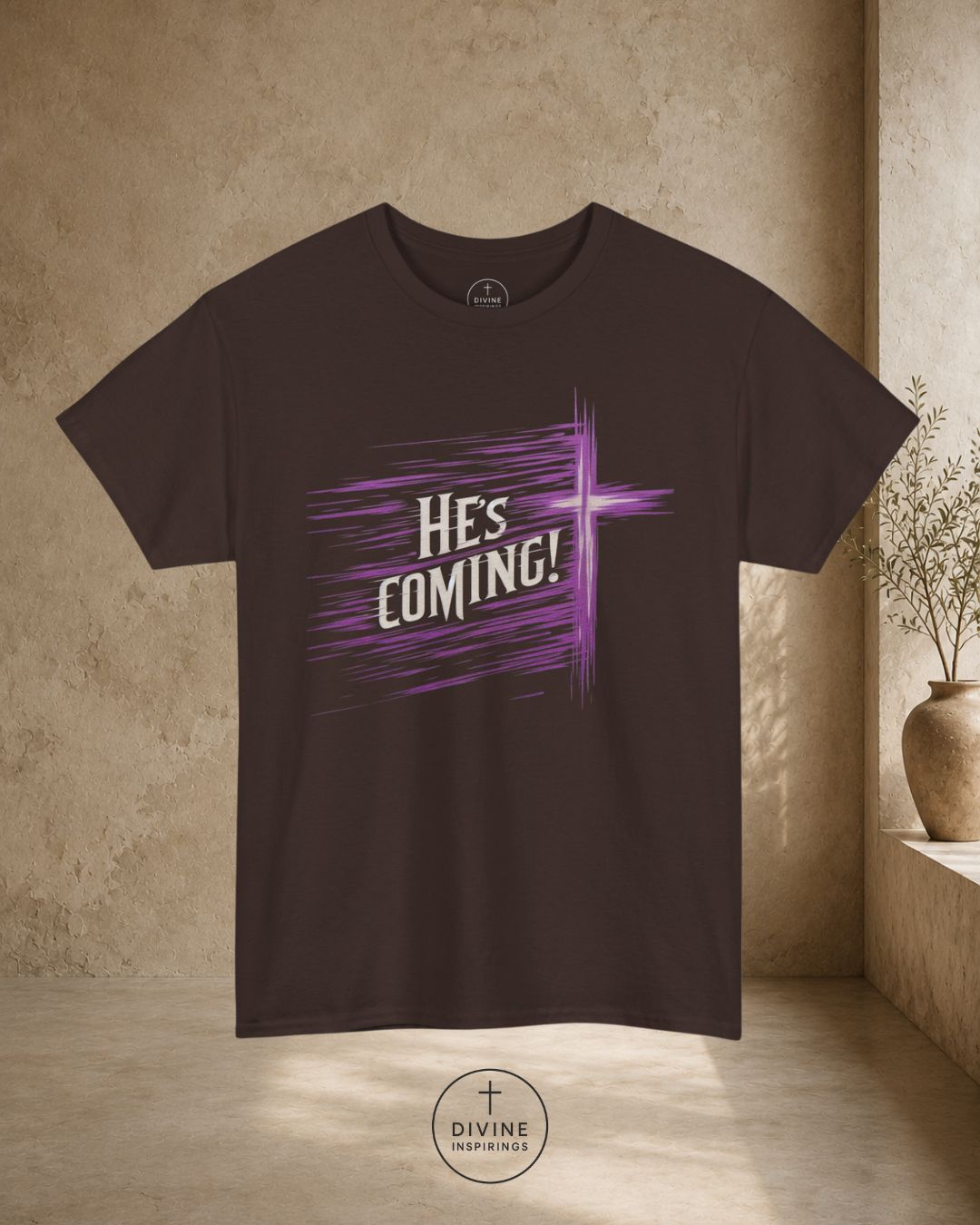 Black t-shirt with 'He's Coming!' design on a beige background