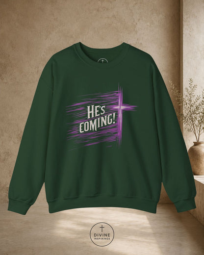 Green sweatshirt with 'He's Coming!' text on a beige background