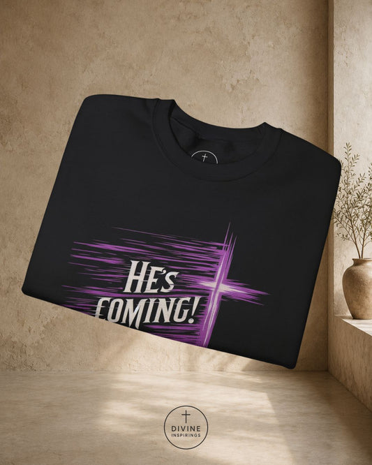 Black t-shirt with 'He's Coming!' design on a beige background