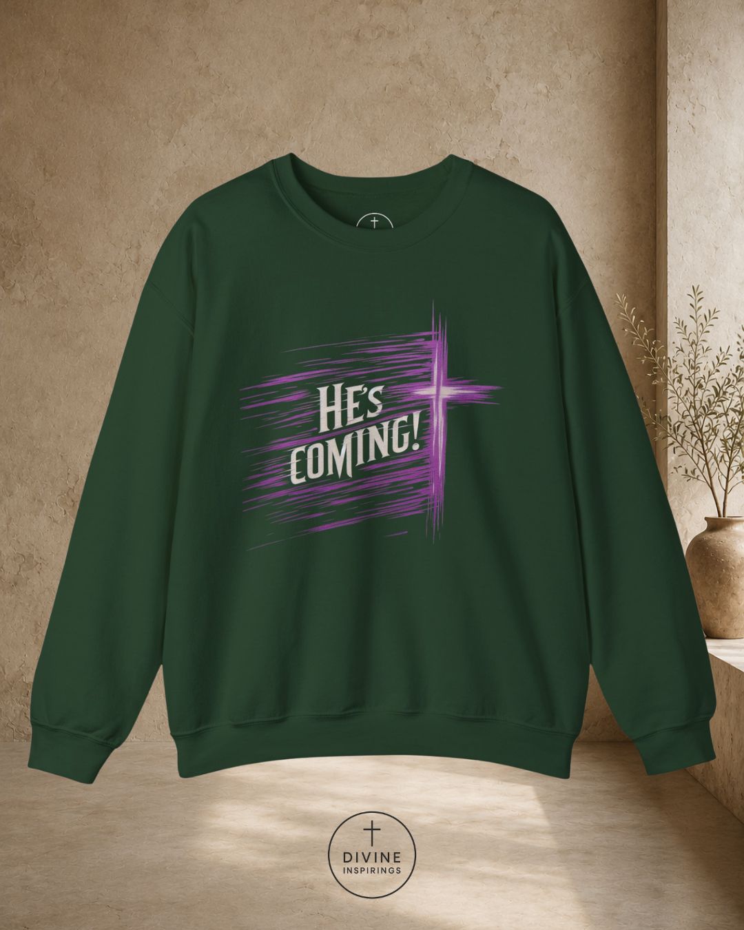 Green sweatshirt with 'He's Coming!' text on a beige background