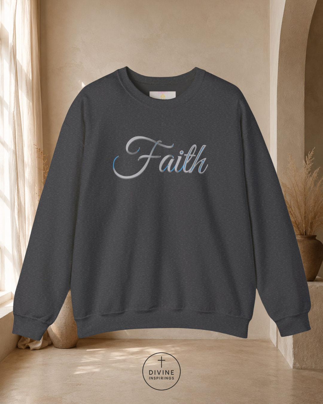 Dark gray sweatshirt with 'Faith' text in a room with natural light