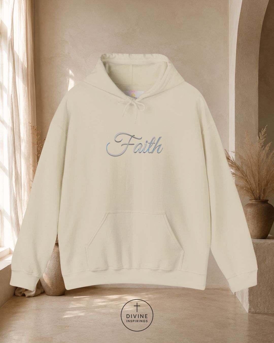 White hoodie with 'Faith' embroidery on a neutral background