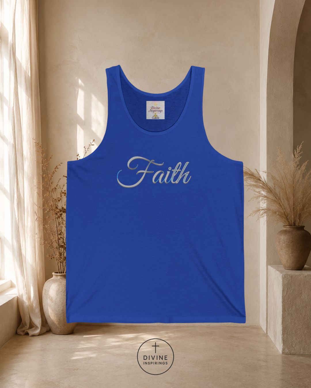 Blue tank top with 'Faith' printed on it in a room with natural light