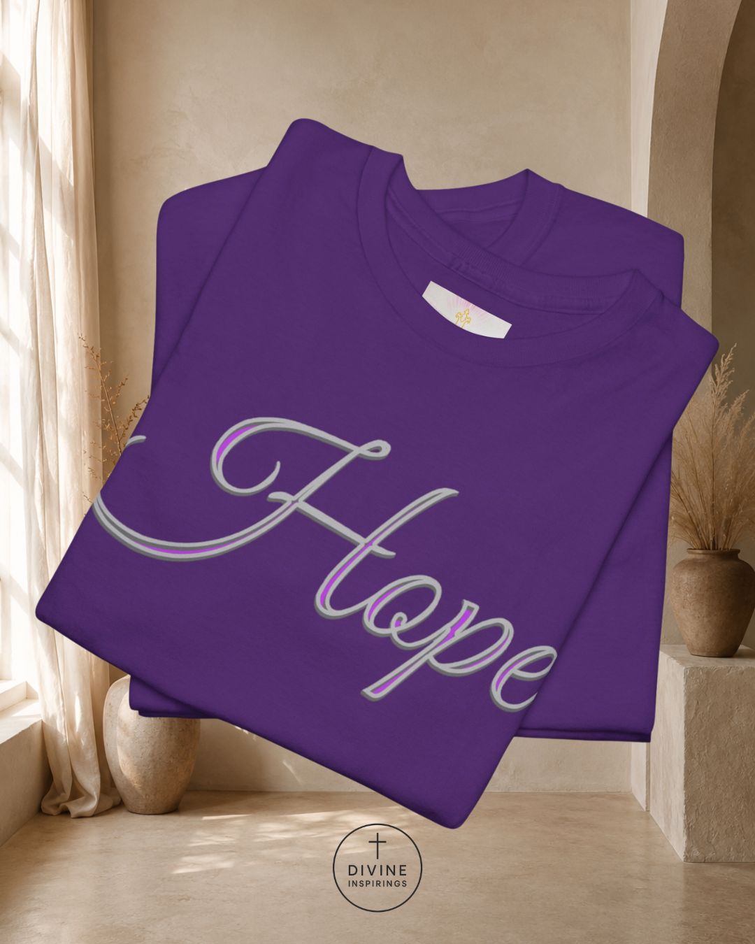 Purple sweatshirt with 'Hope' printed on it, folded and displayed indoors.