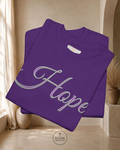 Purple sweatshirt with 'Hope' printed on it, folded and displayed indoors.