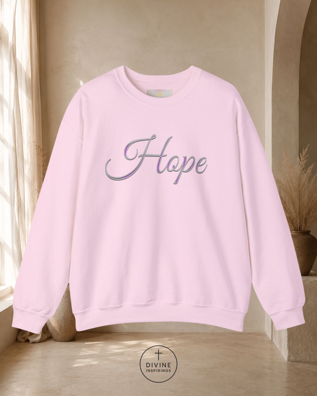 White sweatshirt with 'Hope' text in a room with beige walls and a window.