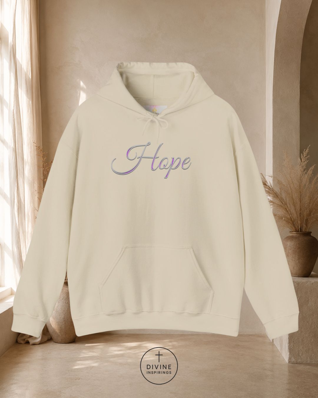 White hoodie with 'Faith' embroidery on a neutral background