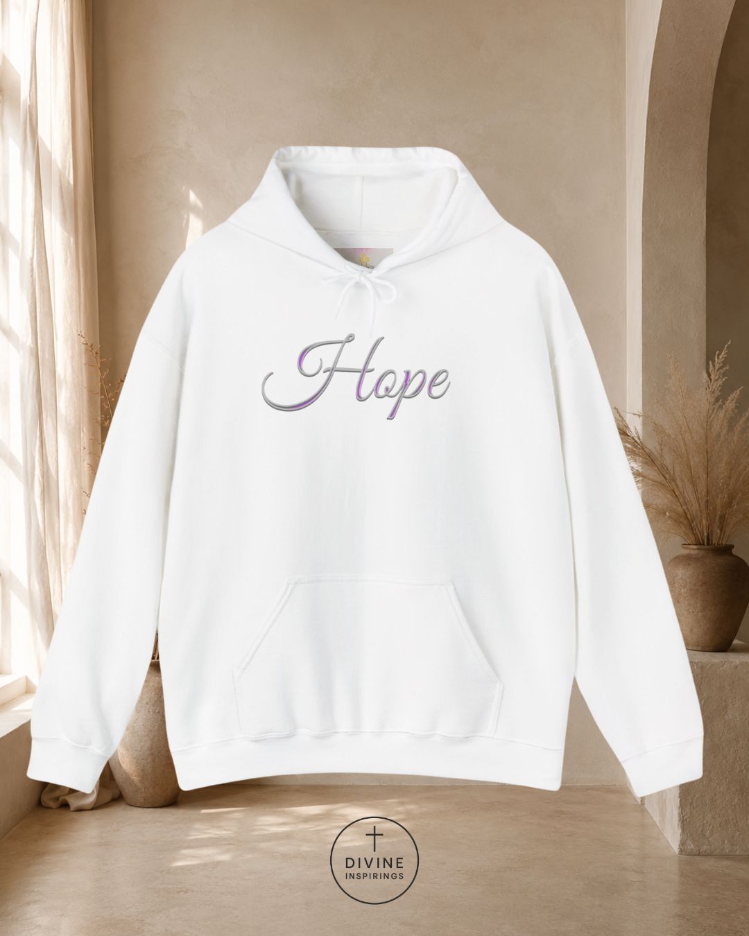 White hoodie with 'Faith' text on a neutral background