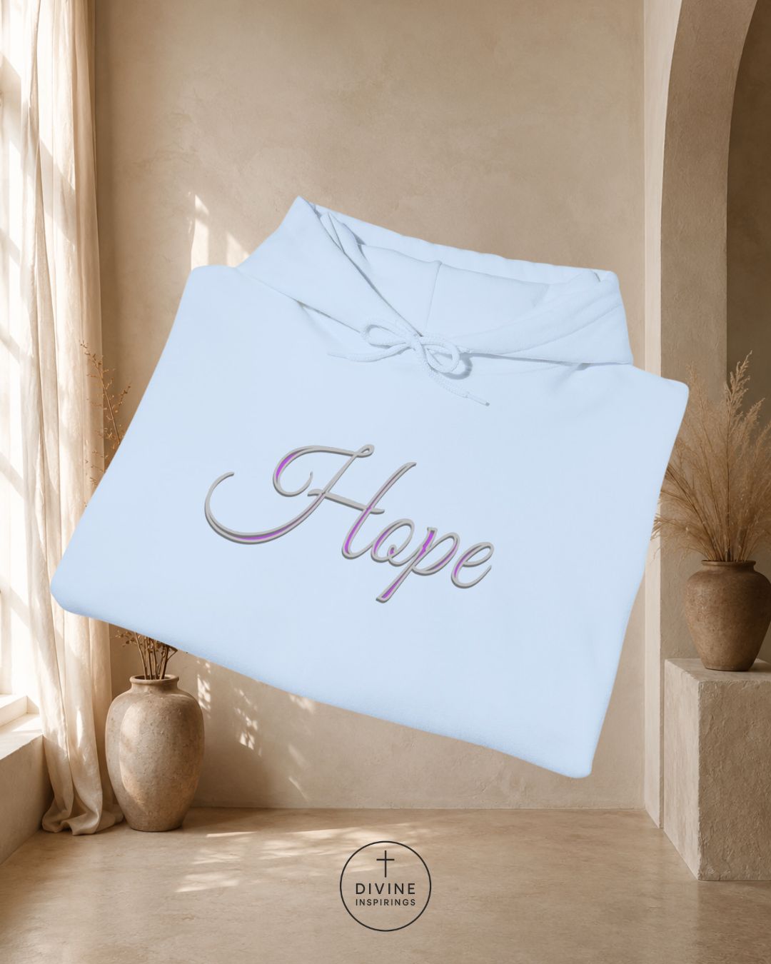 Light blue blanket with 'Hope' embroidery in a warm interior setting