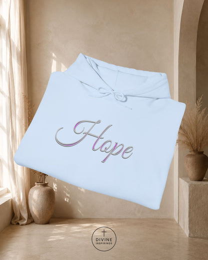 Light blue blanket with 'Hope' embroidery in a warm interior setting