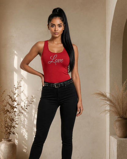 Woman wearing a red tank top with 'Love' printed on it, standing indoors.