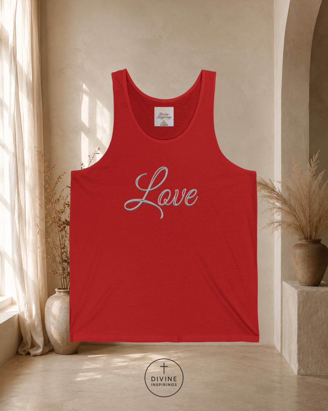 Red tank top with 'Love' printed on it in a room with natural light
