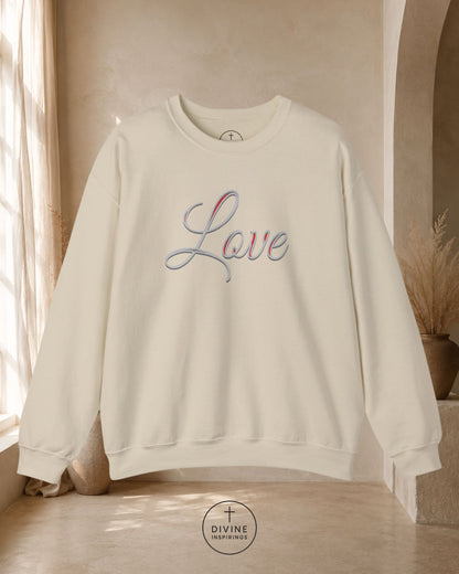 Beige sweatshirt with 'Love' embroidery in blue on a neutral background