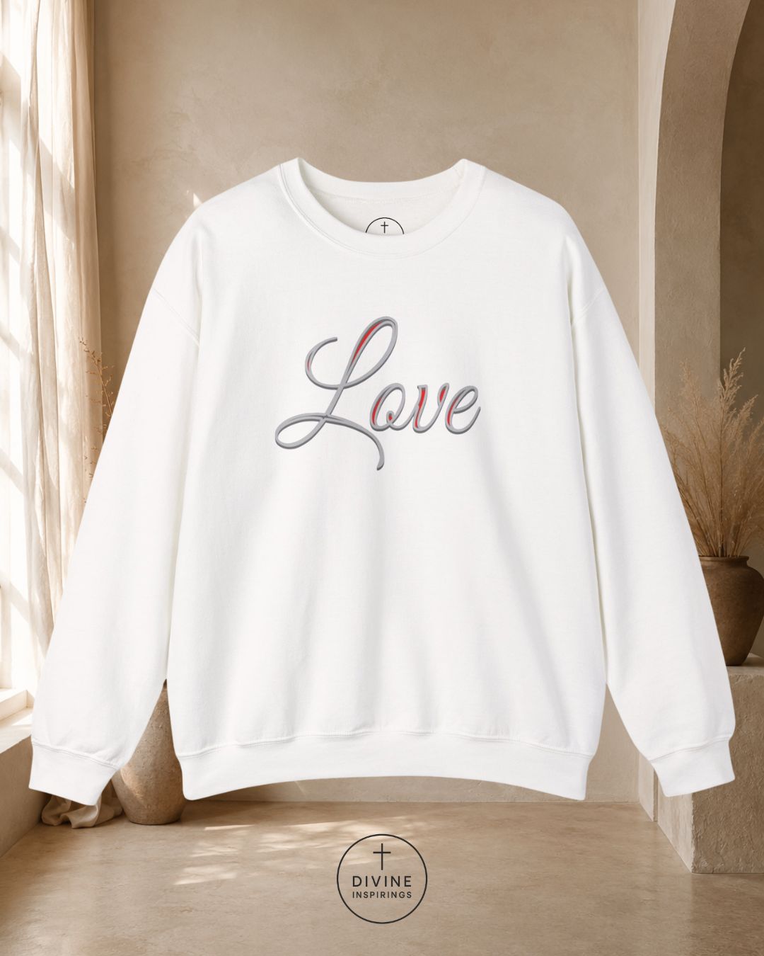 White sweatshirt with 'Love' text in a neutral indoor setting