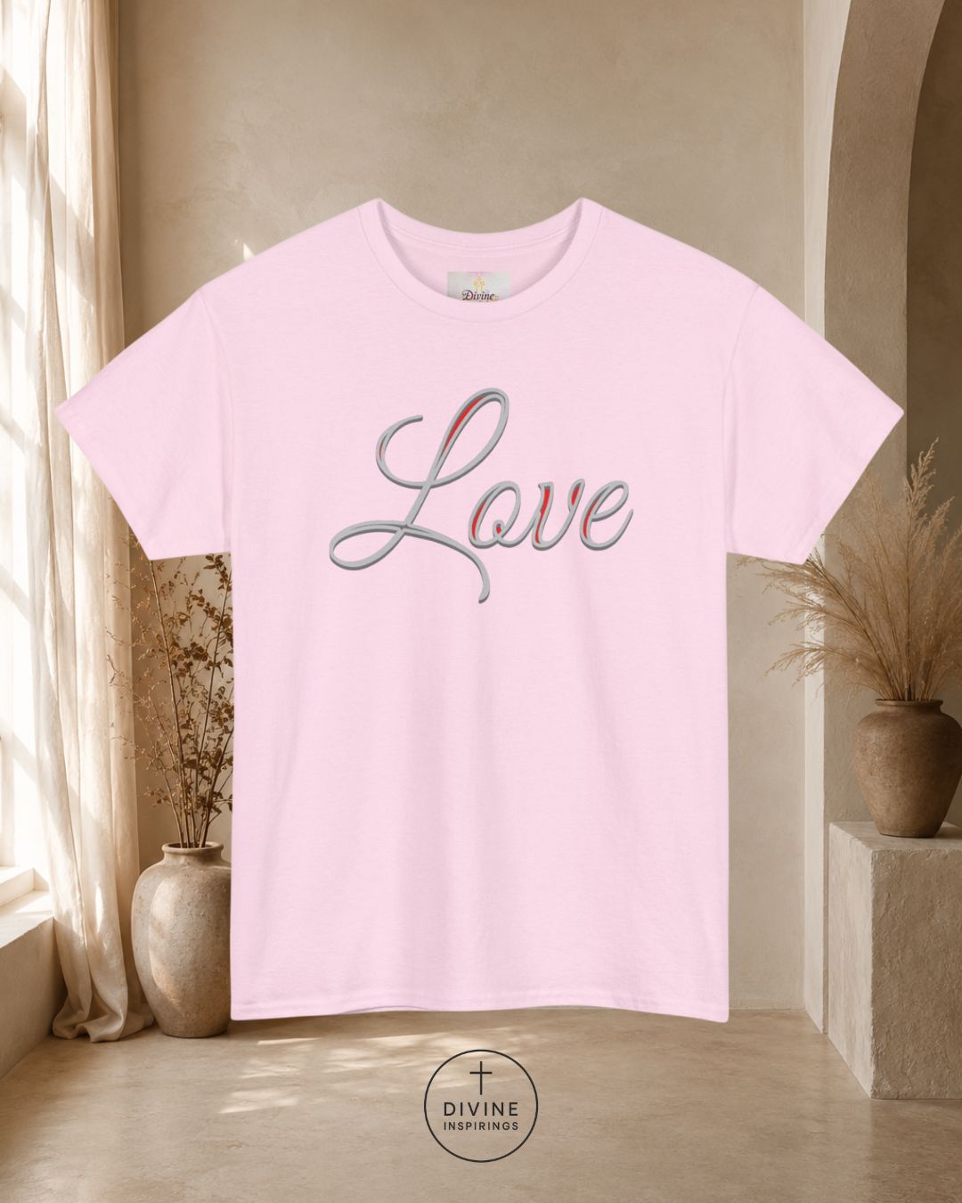 Pink t-shirt with 'Love' text in a home setting