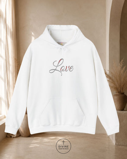 White hoodie with 'Love' text on a neutral background