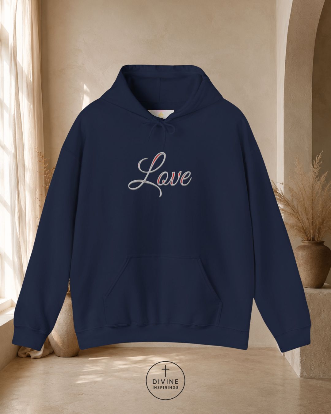 Black hoodie with 'Love' text on a neutral background