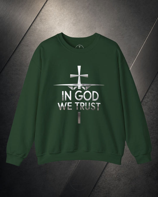Green sweatshirt with 'In God We Trust' text and cross design on a dark background