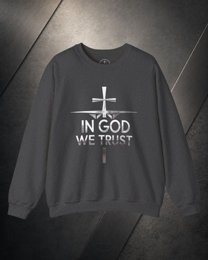 Gray sweatshirt with 'In God We Trust' text and cross design on a dark background
