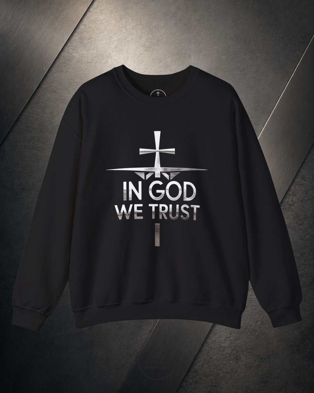 Black sweatshirt with 'In God We Trust' text and cross design on a dark background