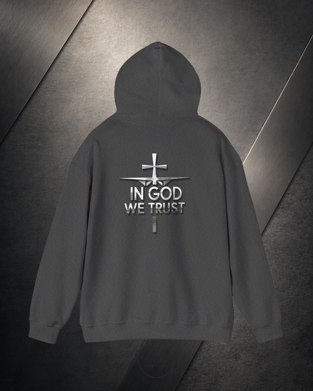 Dark gray hoodie with 'In God We Trust' text and cross design on a textured gray background