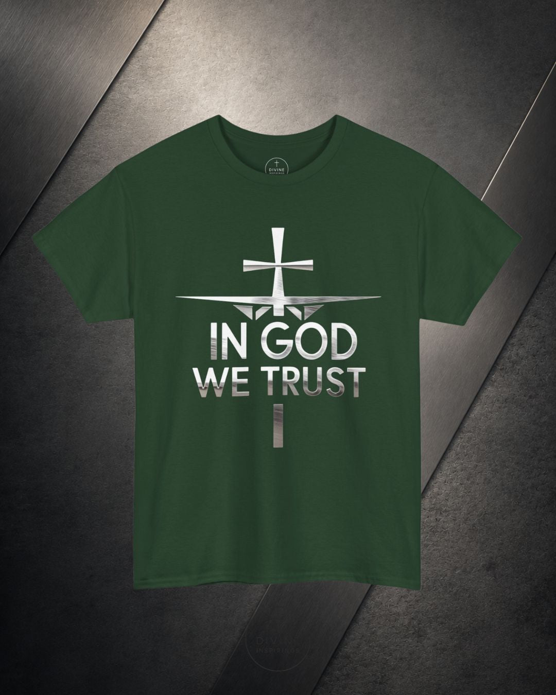 Green t-shirt with 'In God We Trust' text and cross design on a dark surface