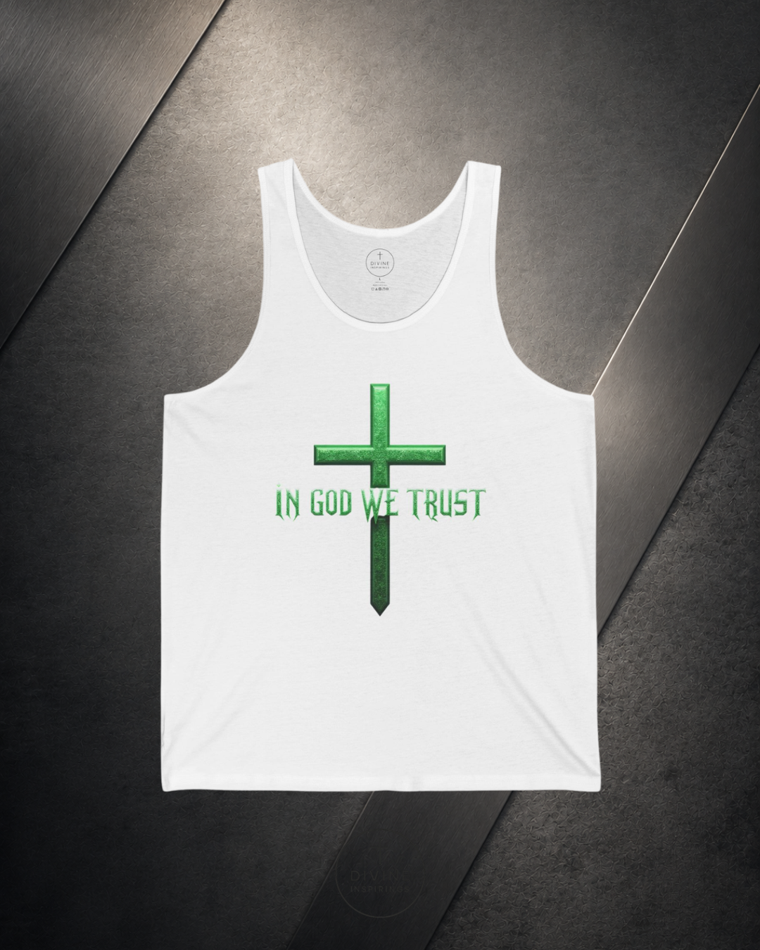 White tank top with green cross and 'IN GOD WE TRUST' text on a dark surface