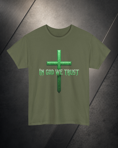 Green t-shirt with a cross and 'In God We Trust' text on a dark surface