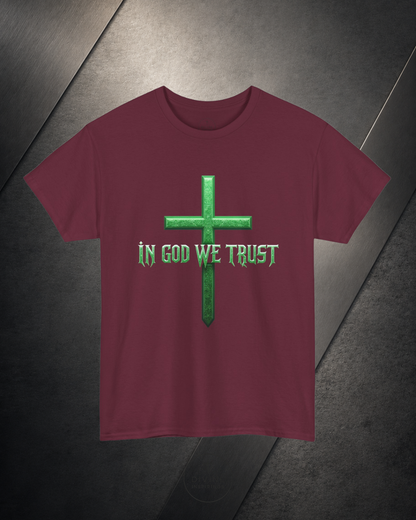 Maroon t-shirt with green cross and 'In God We Trust' text on a dark surface