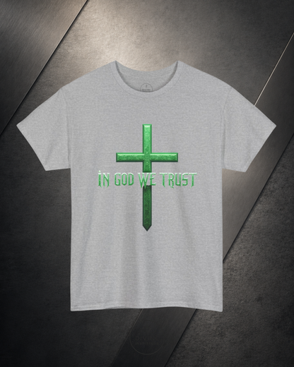 Gray t-shirt with green cross and 'IN GOD WE TRUST' text on a dark surface