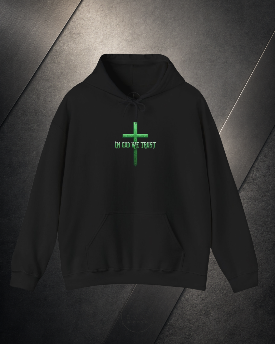 Black hoodie with 'In God We Trust' text and cross design on a dark background