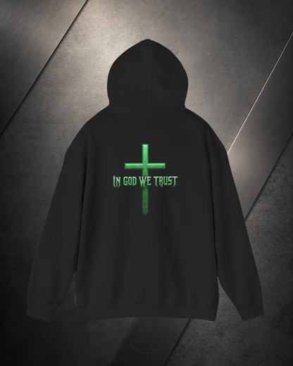 Black hoodie with green 'In God We Trust' text on a dark background