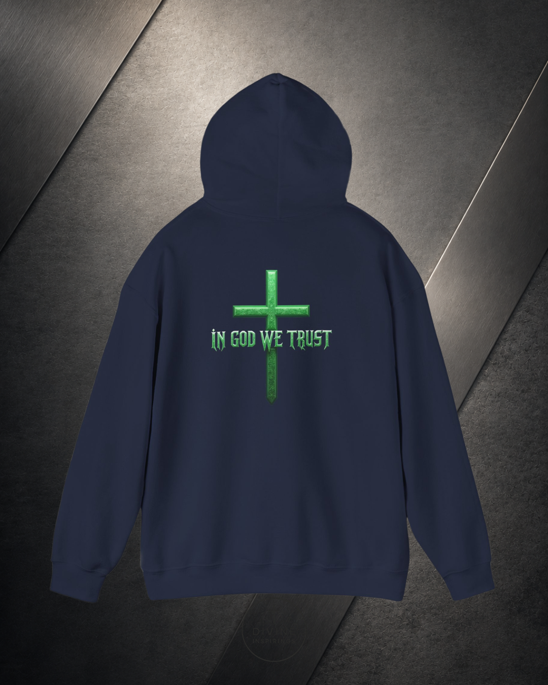 Navy blue hoodie with green cross and 'In God We Trust' text on a dark surface