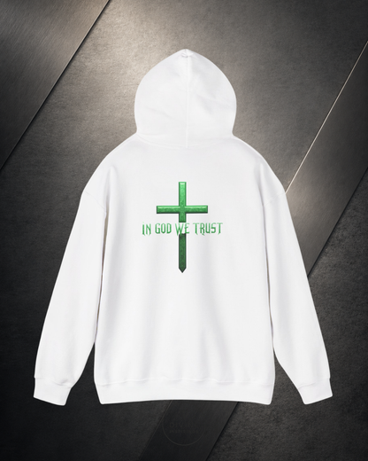 White hoodie with green cross and 'IN GOD WE TRUST' text on a dark background