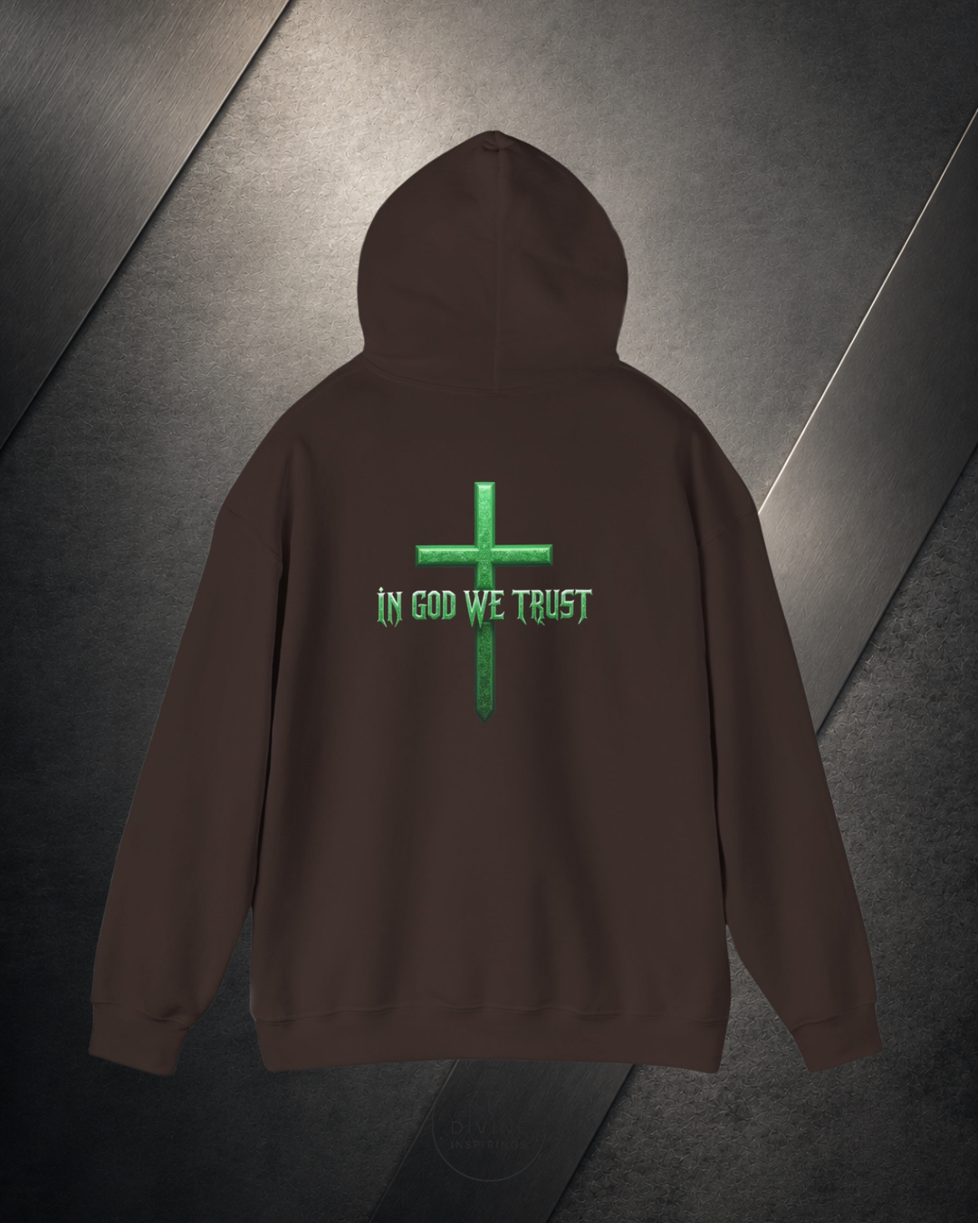 Brown hoodie with green cross and 'In God We Trust' text on a reflective surface