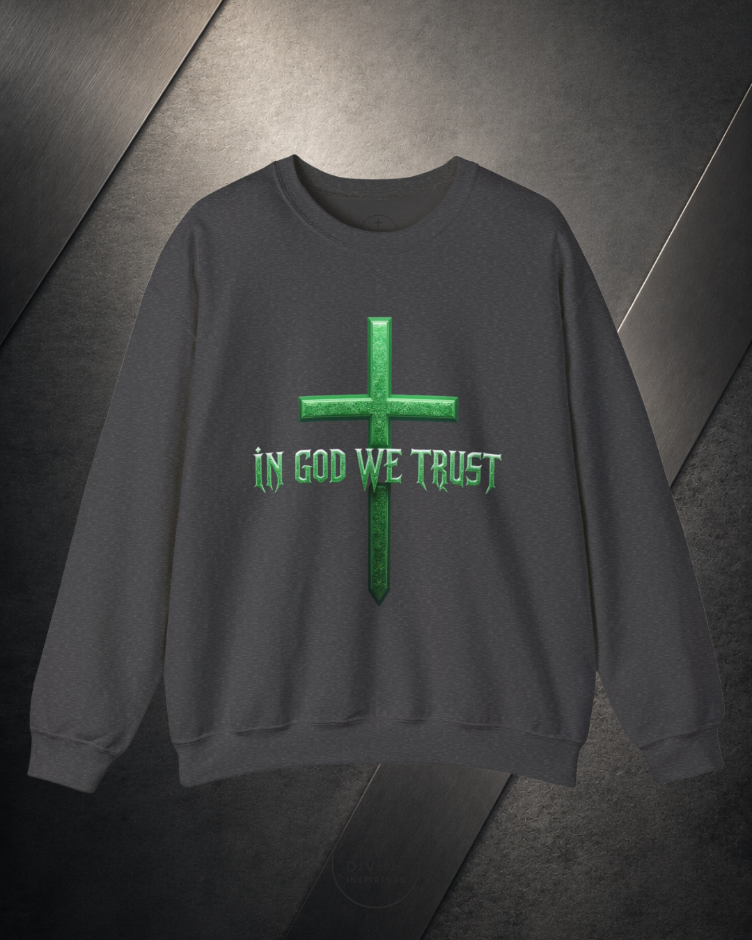 Gray sweatshirt with green cross and 'In God We Trust' text on a dark background