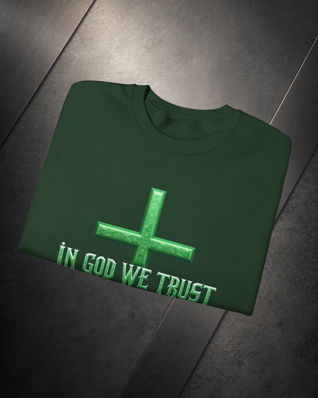 Green sweatshirt with 'In God We Trust' text on a dark surface