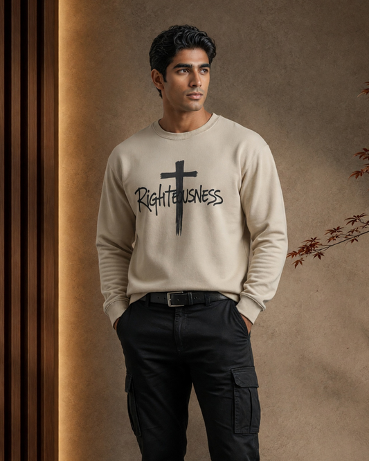 Man wearing a beige sweatshirt with 'Righteousness' text and cross graphic against a brown background