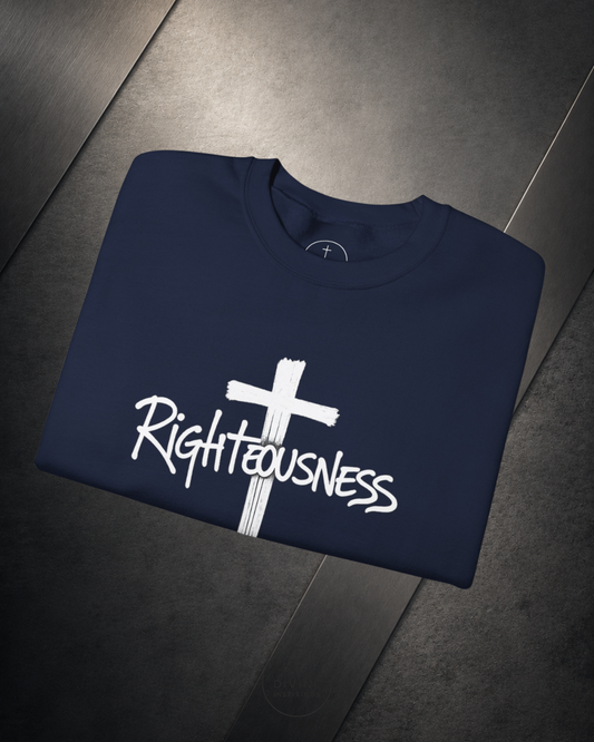 Navy blue sweatshirt with a white cross and 'Righteousness' text on a dark floor.