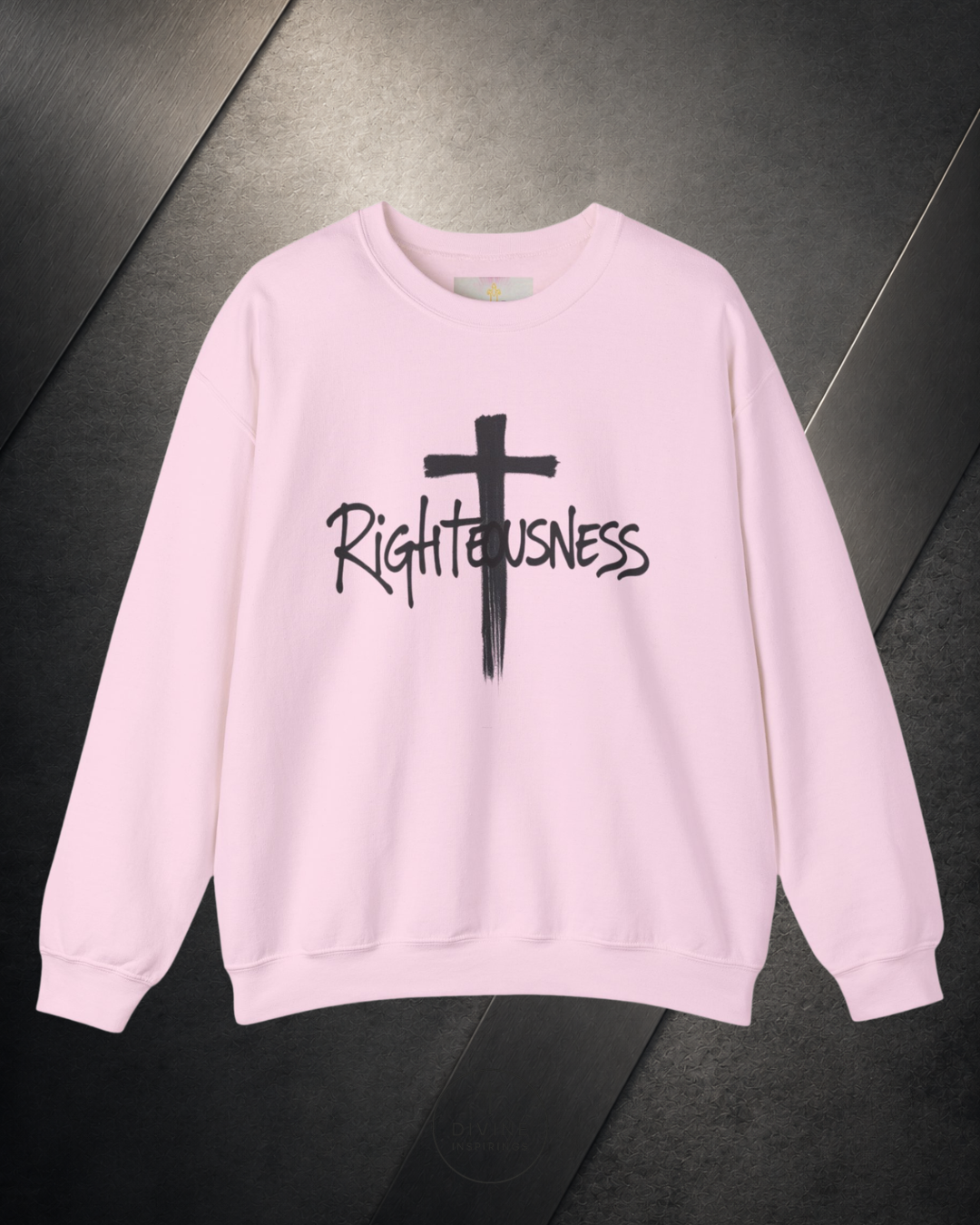 Beige sweatshirt with a black cross and 'Righteousness' text on a dark surface