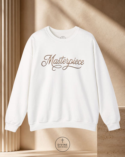 White sweatshirt with 'Masterpiece' text on a beige background
