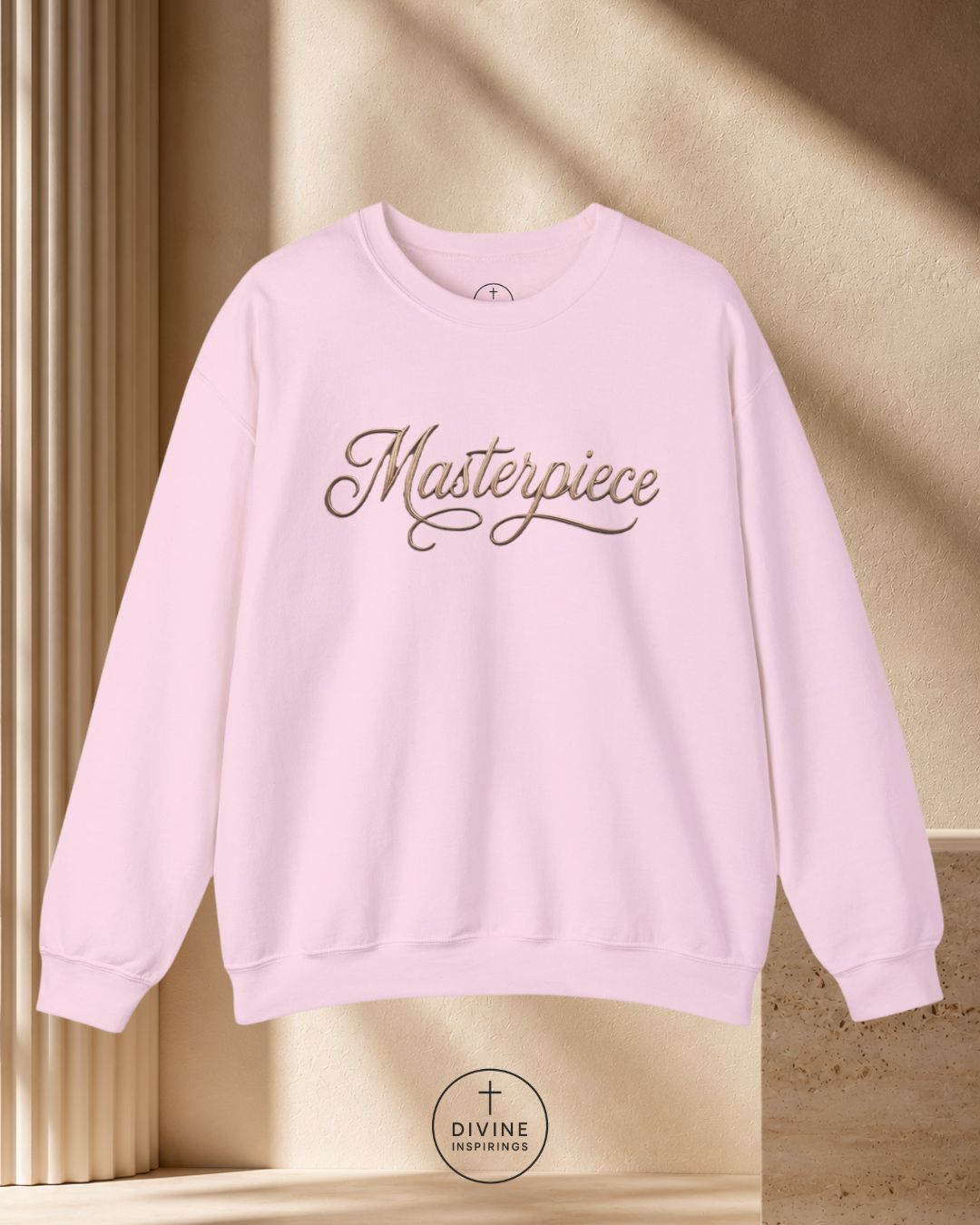 White sweatshirt with 'Masterpiece' text on a beige background