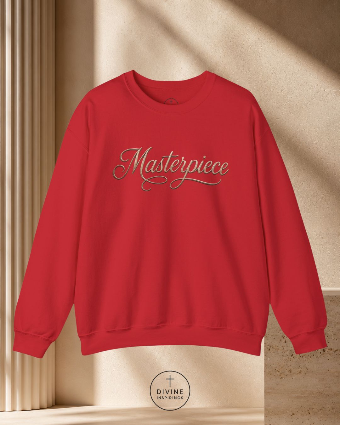 Red sweatshirt with 'Masterpiece' text on a beige background