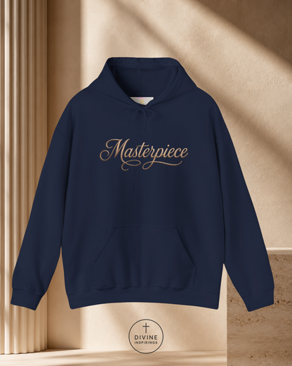 Navy blue hoodie with 'Masterpiece' text on a beige background