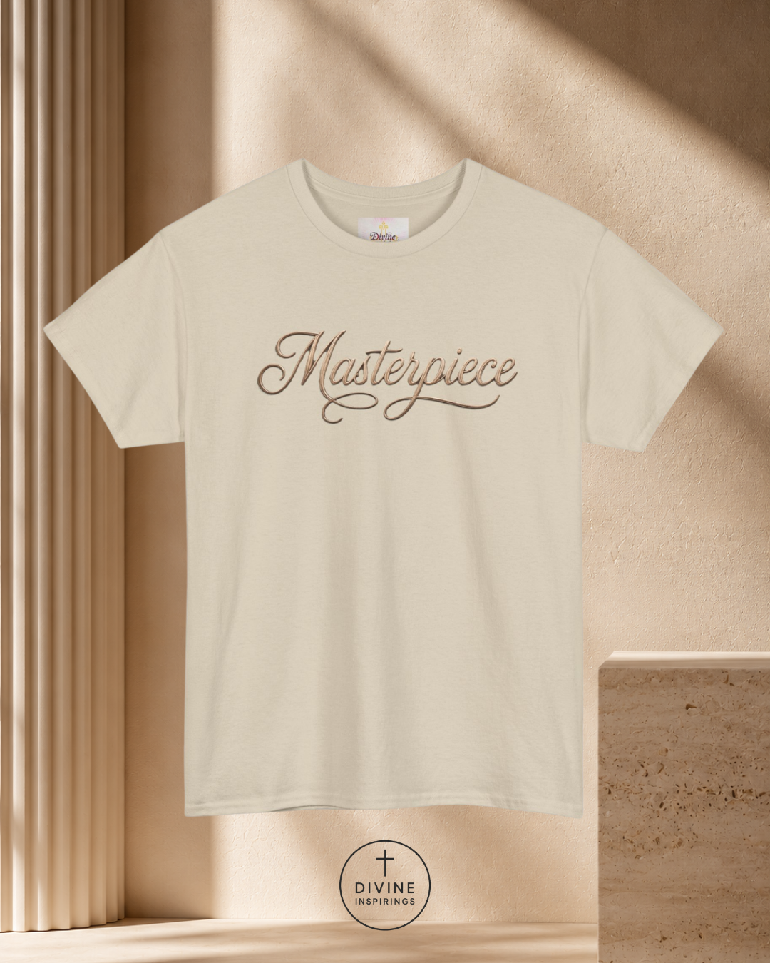 Beige t-shirt with 'Masterpiece' text on a beige background