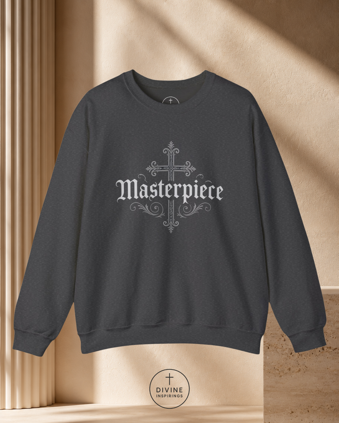 Dark gray sweatshirt with 'Masterpiece' design on a beige background