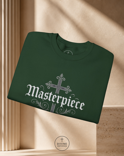 Green sweatshirt with 'Masterpiece' design on a beige background