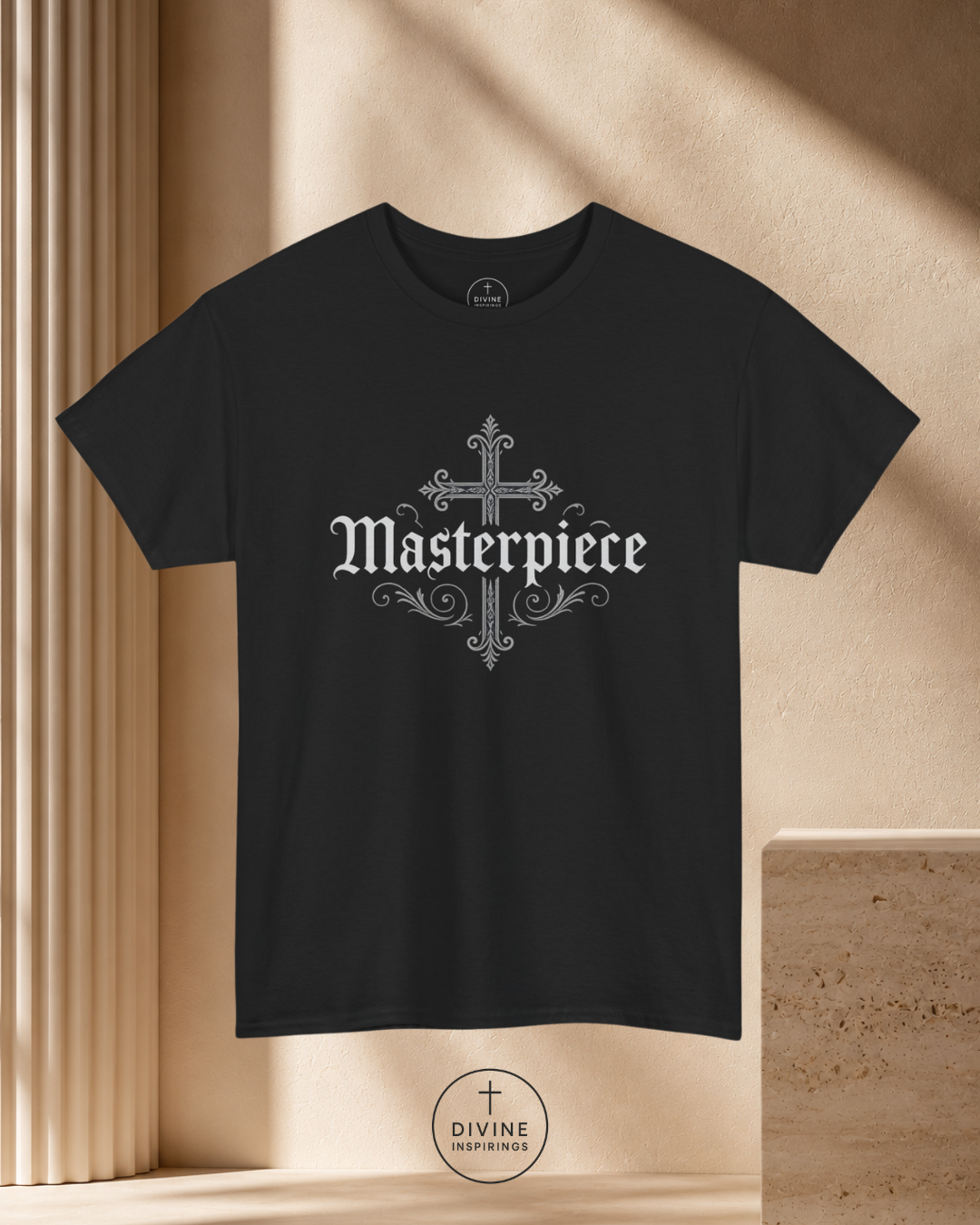 Black t-shirt with 'Masterpiece' design on a beige background