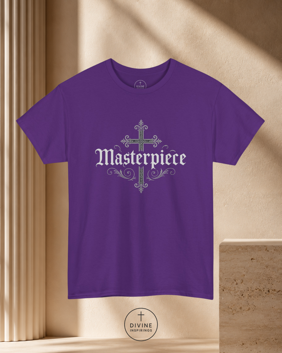 Purple t-shirt with 'Masterpiece' design on a beige background